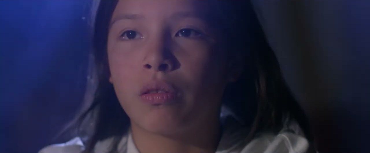 A young singer in the Tied music video
